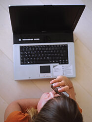 Woman using mobile phone, elevated view - DK00048