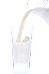 pouring fresh milk into glass, cut-out, white background - 01396CS-U