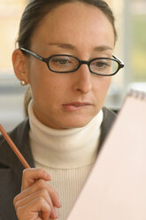 Business woman reading, close-up - 00088CK