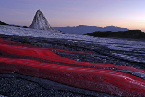 Tanzania, soda lava from Ol Doinyo Lengai volcano at dusk - RM00037