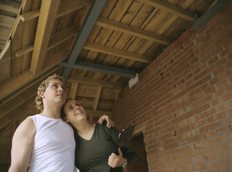 Young couple visiting their future home - PEF00357