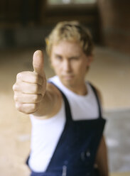 Young craftsman giving thumbs up - PEF00352