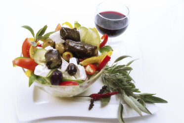 Vine leaves on greek salad, elevated view - 01116CS-U