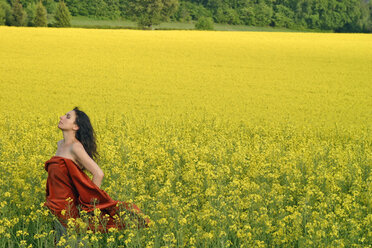 Woman in rapeseed field - NCF00163
