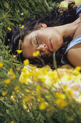 Woman lying and sleeping in meadow - LDF00083