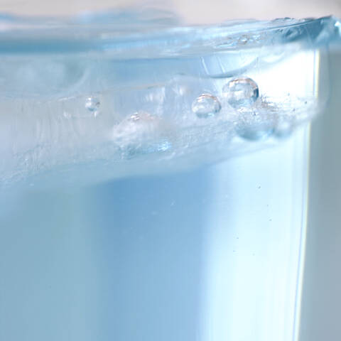 Air bubbles in a water glass, close-up stock photo