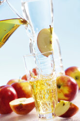 Pouring apple juice into glass - 02561CS-U