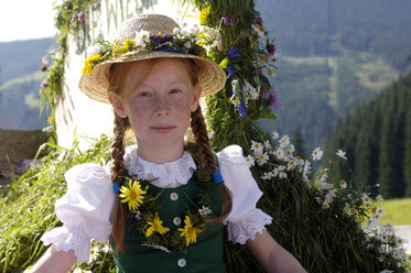 Austria, Salzburg land, Girl in traditional costume sitting in wagon - HHF00108