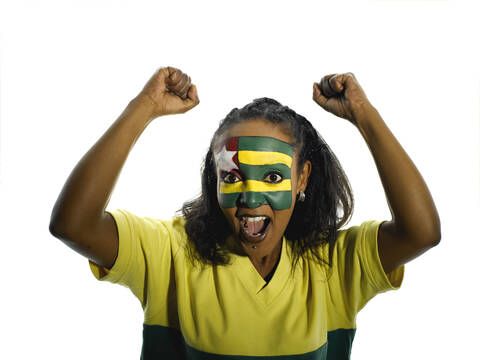 Frau mit Togo-Flagge im Gesicht, Nahaufnahme, Porträt, lizenzfreies Stockfoto