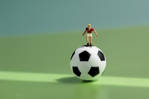 Toy figurine on football - ASF01466