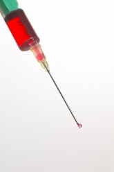 Syringe with red liquid, close-up - THF00073