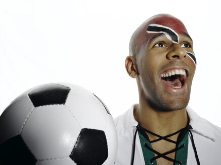 Fußballfan mit der Flagge von Trinidad und Tobago im Gesicht - LMF00446