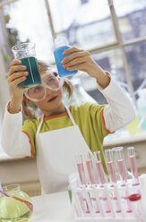 Girl (8-9) in chemical lab wearing protective goggles - WESTF00023