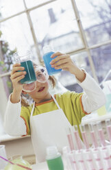 Girl (8-9) in chemical lab - WESTF00022