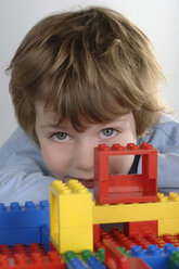 Boy playing with LEGO bricks - CRF00841