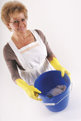 Mature woman with cleaning bucket and gloves, elevated view, portrait - 00020LRH-U