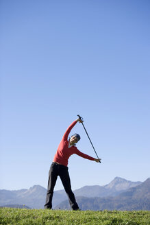 Woman exercising Nordic Walking, Austria, alps - WESTF00152