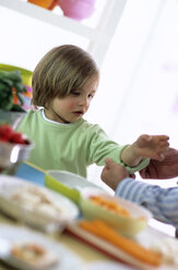 Father rolling up sleeves of son - WESTF00204