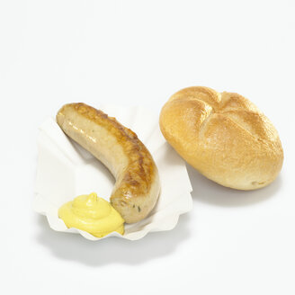 German Bratwurst, fried sausage and bread with mustard in paper plate - WESTF00383