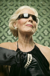 Senior woman wearing sunglasses - WEST00364