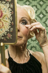 Senior woman with mirror - WEST00348