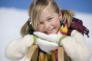Young girl leaning on sledge - WESTF00689