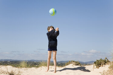 Portugal, Algarve, boy (8-11) playing with ball at beach - MSF01943