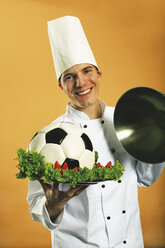 Chef serving football in plate - RDF00116