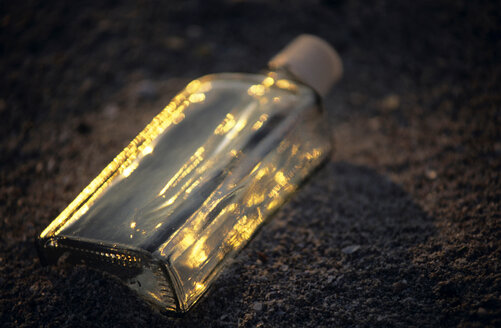 Bottle on beach, Apulia,Italy - MOF00110
