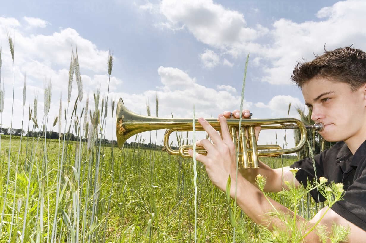 Teenage Boy Playing Trumpet Side View High-Res Stock Photo - Getty Images