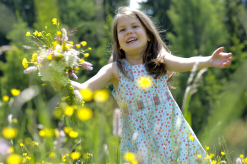 Girl with bunch of flowers in summer meadow - WESTF01416