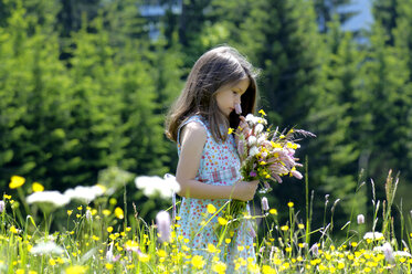 Girl with bunch of flowers in summer meadow - WESTF01406