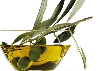 Fresh green olives and olive oil in glass bowl - 04396CS-U