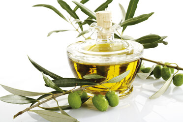Fresh olives on twig and carafe of olive oil - 04390CS-U