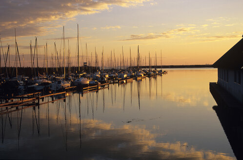 Austria, Burgenland, Boats moored at harbour, dusk - HSF00966