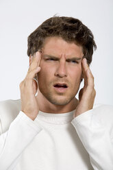 Young man with head in hands, close-up - WESTF01601