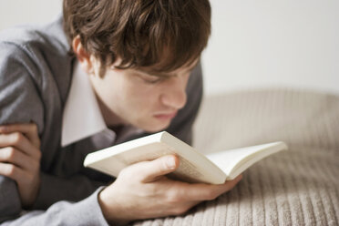 Young man reading book - MFF00234