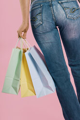 Woman carrying shopping bags, close-up - 00114LR-U