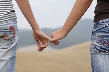 Holding hands, close-up - CRF00955