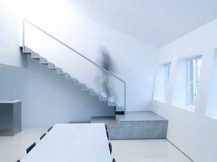 Person walking upstairs, side view - KM00482