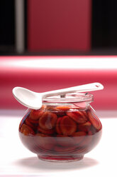Stewed fruit in glass with spoon - ASF02558
