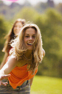 Young woman in meadow, portrait - KMF00225