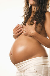 Pregnant woman, hand on breast, midsection - LDF00277