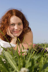 Young couple lying in meadow - LDF00253