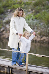 Mother with daughter on jetty - WESTF03032