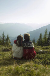 Young couple sitting in mountains - BABF00191