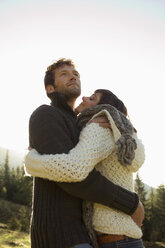 Young couple embracing, close-up - BABF00084