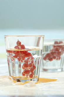 Red currant in glasses of water - ASF02595