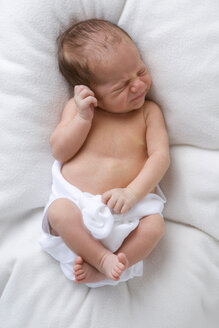 Baby in diaper sleeping, elevated view - SMOF00094