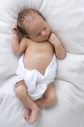 Baby in diaper sleeping, elevated view - SMOF00093